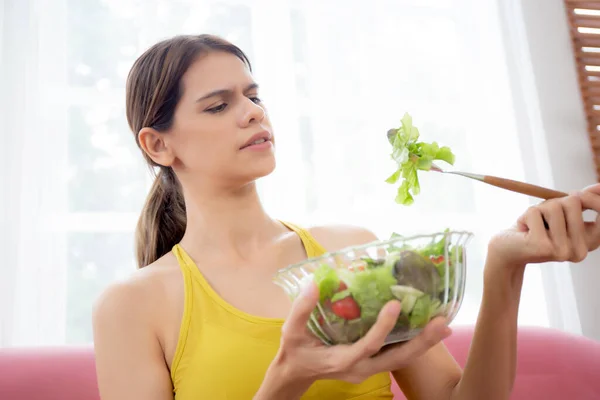 Young Caucasian Woman Sitting Sofa Eating Vegetable Salad While Feeling — Stock Photo, Image