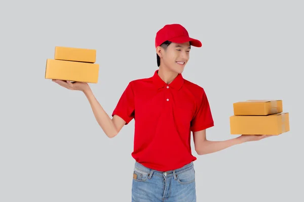 Young Asian Man Uniform Red Cap Standing Carrying Box Stack — Φωτογραφία Αρχείου