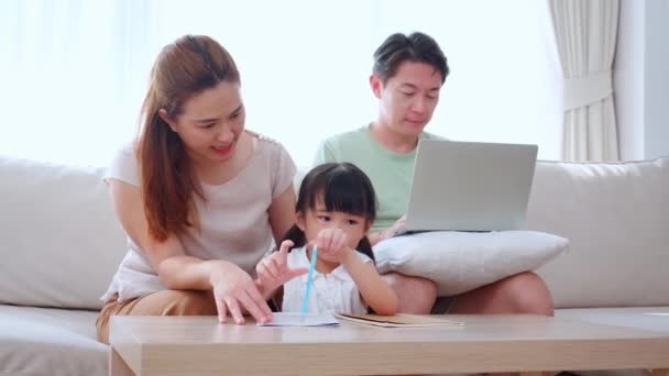 Happy Family Mother Teaching Homework Daughter Father Working Laptop Sofa — Stock Video