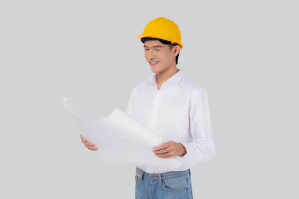 Portrait Young Asian Man Engineer Wearing Helmet Holding Looking Blueprint — Zdjęcie stockowe