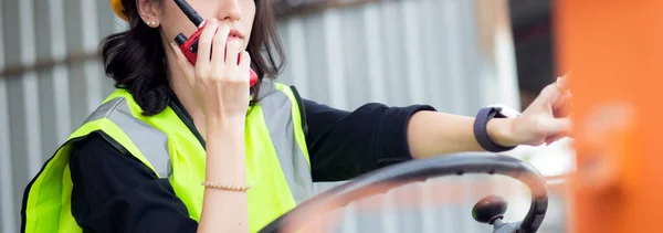 Young Asian Woman Foreman Using Radio Communication While Driving Forklift — Foto de Stock