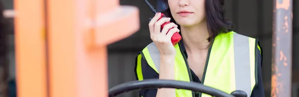 Young Asian Woman Foreman Using Radio Communication While Driving Forklift — Photo