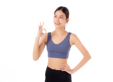Spor kıyafetleri içindeki güzel Asyalı kadın portresi beyaz arka planda izole edilmiş, spor ve egzersiz sağlık, eğitim ve güç için izole edilmiş, kendine güvenen zayıf bir kadın..