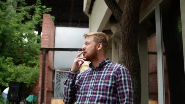 Handsome Irish Man Large Beard Smokes Cigarette Blows Smoke Nicotine — Stockvideo