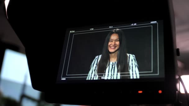 Backstage Studio Television Filming Talk Shows Asian Girl Presenter Listens — Stock Video