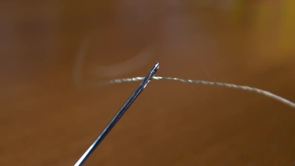 Macro Video Shooting Needle Hole Close Thread Passing Eye Needle — Stock Video