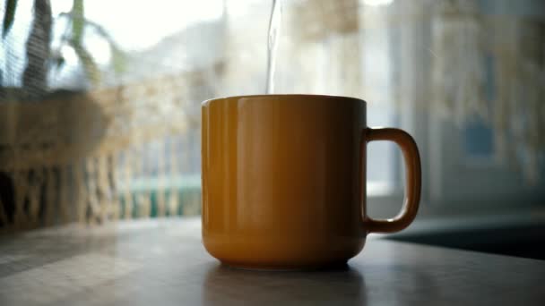 Pours Hot Boiled Water Orange Cup Tea Preparing Tea Sunny — Stock Video