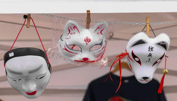 White Japanese masks of a cat, a dog and kabuki