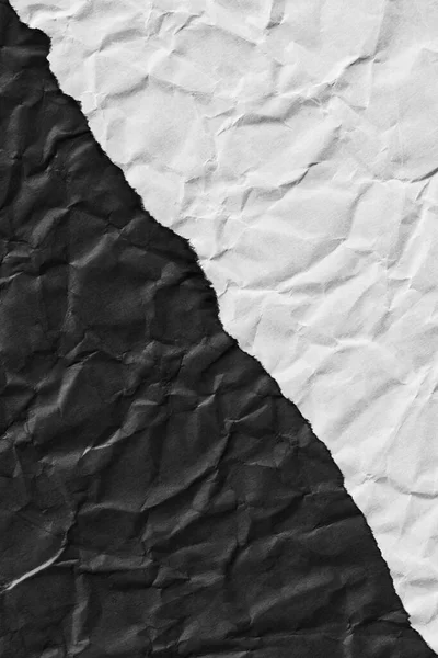torn edge of dark and light paper. diagonal edge crossing. texture