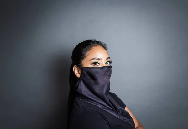 mexican woman wearing bandana type face mask