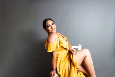 portrait attractive and sensual hispanic model showing leg