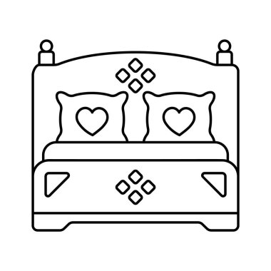 Süslü bir yatak, yeni evlilerin ilk gecesini simgeliyor.