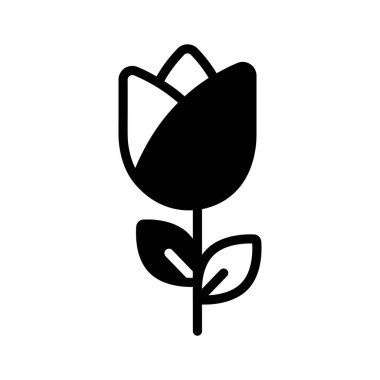 Canlı bir lale, bahçeye renk ve güzellik katıyor.