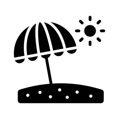 Kumsalda bir şemsiye, gevşemeyi ve tropikal tatilleri temsil ediyor..