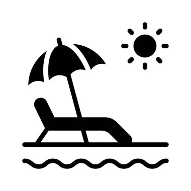 Güneşin altındaki bir sahilde şemsiye. Tatil havasını simgeliyor..