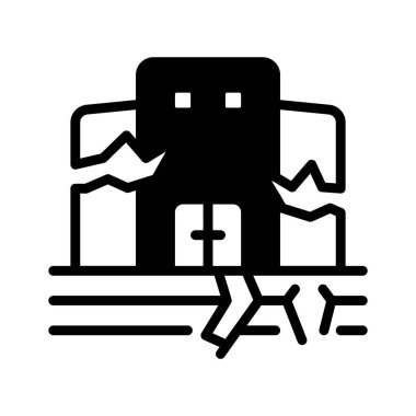 Deprem hasarını veya sismik aktiviteyi sembolize eden çatlakları olan bir bina