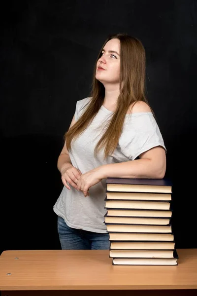 Girl European Appearance Stands Black Wall Stack Books — Stock Photo, Image