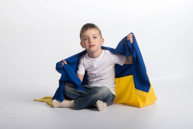 a boy with a flag of Ukraine on a white background
