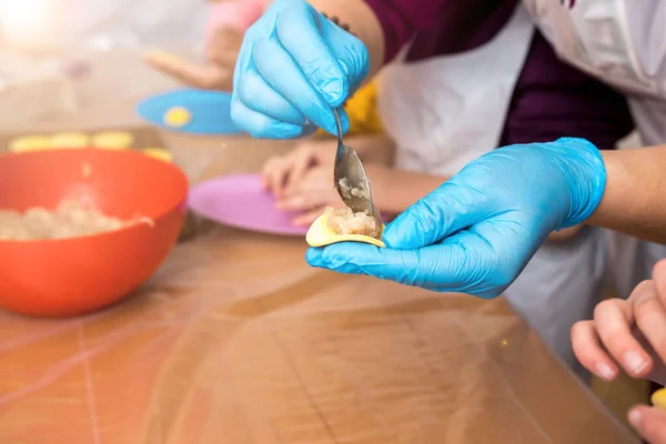 stock image molding dumplings or ravioli at home.