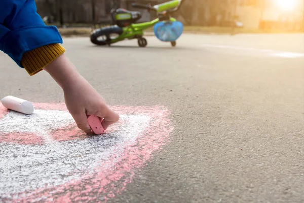 drawing with colored chalk on the road