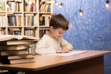 A child working on a piece of paper at a desk with a stack of books and a pencil, set against a cozy bookshelf background with string lights. Perfect for educational and study themes. clipart