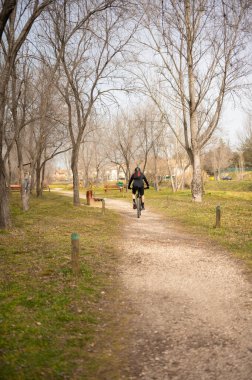 Riding Through the Countryside: A Man's Adventure on a Dirt Road