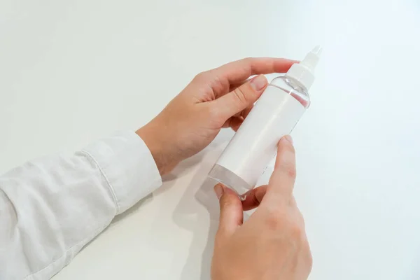 Cosmetologist (dermatologist) holds tube for cosmetic products. Cosmetics, beauty and spa concept