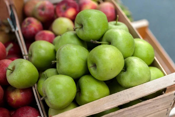 Autumn harvest of apples, sale of seasonal goods at the street fair. Selective focus