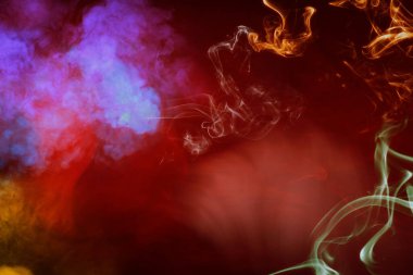 Vibrant abstract composition of colorful smoke in red, purple, and orange tones, evoking a sense of creativity and fluid expression. clipart