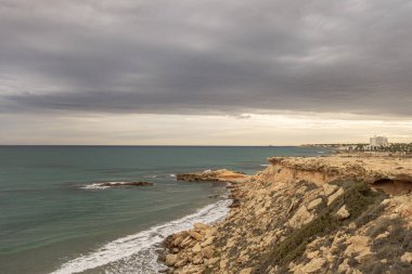 Stormy sky on La Zenia beach in Alicante. Spain. clipart