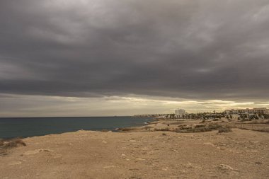 Stormy sky on La Zenia beach in Alicante. Spain. clipart