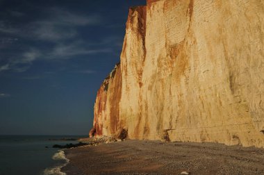 At The Bottom Of The White Cliffs Les Grandes Dalles In Fecamp Normandy France On A Beautiful Sunny Summer Day With A Clear Blue Sky