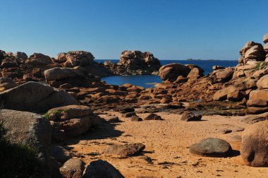 The Beautiful Red Rock Coast In Ploumanach In Bretagne France On A Beautiful Sunny Summer Day With A Clear Blue Sky