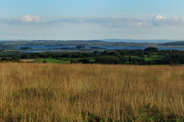 Grasslands In The Parc Naturel Regional d'Armorique In Bretagne France On A Beautiful Sunny Summer Day With A Few Clouds In The Sky