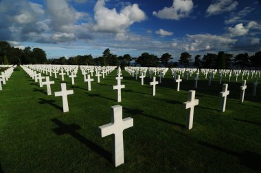 White Crosses For Fallen US Soldiers At The American Cemetery In Normandy France On A Beautiful Sunny Summer Day With A Few Clouds In The Sky