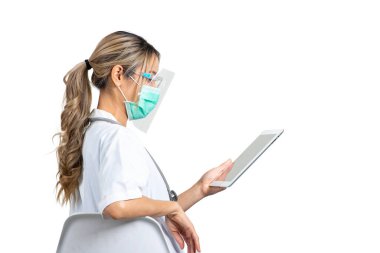 Side view studio shot photo of woman doctor sits on chair while looking at digital tablet in hand on white background. clipart