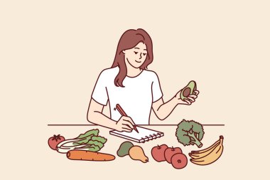 Sebzeli bir kadın not defterine kalori sayıyor ya da yeni keto diyeti için plan yapıyor. Kız sadece çiftçilerin yetiştirdiği organik sebzeleri seçerek besleniyor. 