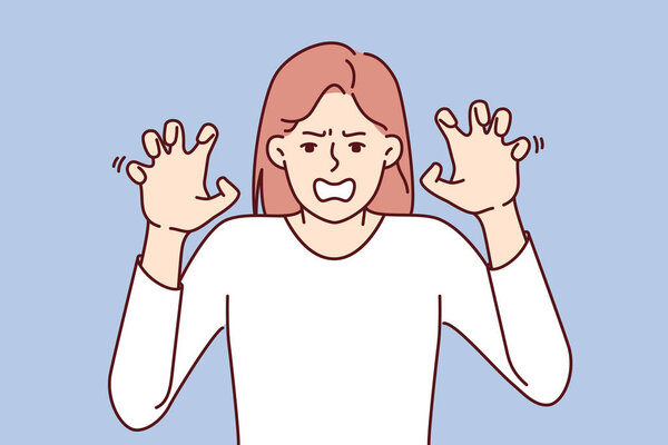 Нервная женщина обнажает зубы и показывает ногти, принимая позу кота, угрожая выколоть противнику глаза. Нервная девушка с агрессией смотрит на экран, чувствуя ненависть и желание бороться