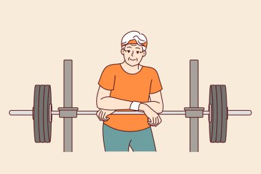 Eğitim için halterli yaşlı bir adam spor kulübünde spor eğitmeni olarak çalışıyor ve ekrana gülümsüyor. Spor giyim sektöründe erkek emekliler spor salonunda poz veriyor ve sağlık için spor yapmayı öneriyor.