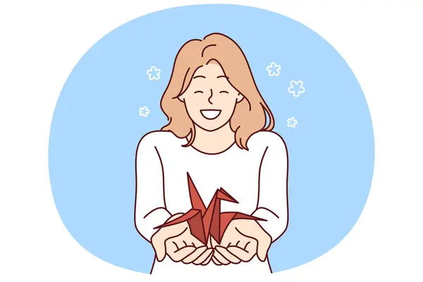 stock vector Woman with origami crane in palms wants to draw attention to problem of wildlife and extinction of animals from red book. Positive smiling girl holding origami bird for creative hobby concept