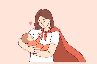 Kırmızı kahraman pelerinli süper anne uzun zamandır beklenen oğlunun doğumuna gülümseyen ve sevinen mutlu bir bebek tutuyor. Kollarında bebek olan süper anne, annelikle ve yeni insana hayat verme fırsatıyla gurur duyuyor.