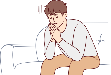 Mutsuz adam kanepeye oturup stres altında.