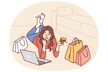 İnternet alışverişinden sonra kredi kartı ve dizüstü bilgisayarı olan ya da popüler bir internet sitesinden mal sipariş eden bir kadın. Yerde yatan ve göz kırpan bir kız banka kartıyla alışveriş yapmaya davet ediyor.