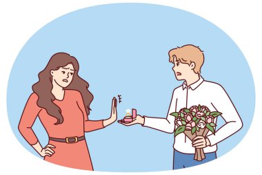 Kadın, elinde nişan yüzüğü ve çiçek olan bir adamın evlenme teklifini reddediyor. Damat, evlilik teklifi üzerine gelin tarafından reddedilir. Evlilik için başarısız çift seçimi kavramı için.