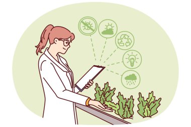 Kadın hidrofonik bitki çiftliğinde çalışıyor. Biyolojik araştırma laboratuvarında bitki yetiştiriyor. Beyaz önlüklü mutlu kız bilimsel çiftlikte çalışan yararlı özellikleri olan otlar üzerinde çalışıyor..