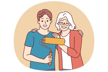 Büyükannem torunu kucaklıyor, tamirat yapıyor ve dairenin duvarlarını boyamak ve içini yenilemek için paten kullanıyor. Yaşlı, kır saçlı kadın, genç ve mutlu bir adamın yanında. Tamirata başlamaya hazır.