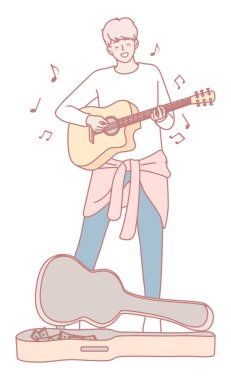 Genç ve yetenekli bir müzisyen gitarını neşeli bir şekilde tıngırdatıyor, yaratıcılığın ve tutkunun canlı özünü yakalıyor.