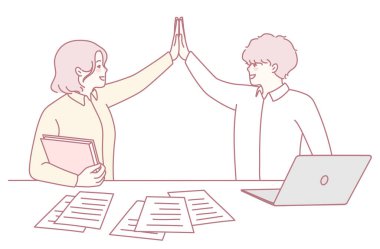 İki kendini işine adamış profesyonelin modern çalışma alanındaki başarılarını kutladığı neşeli ve moral verici bir takım çalışması anı.