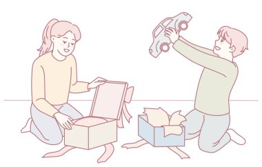 Çocuklar sevinçle yeni oyuncaklarını açıyor. Saf mutluluk, heyecan ve neşe sergiliyorlar.