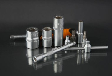 a set of hand tools on a black background